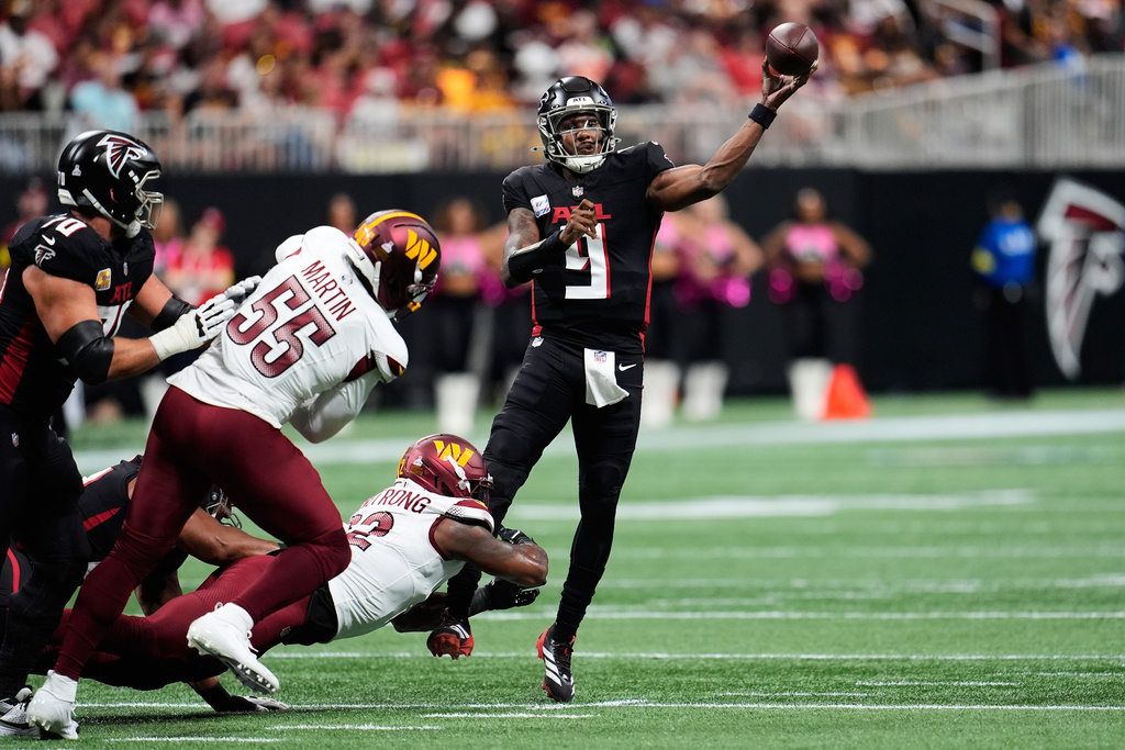 Atlanta Falcons quarterback Michael Penix Jr. (9) throws against the Washington Commanders during the first half of an NFL football game, Sunday, Sept. 28, 2025, in Atlanta. (AP Photo/Mike Stewart)