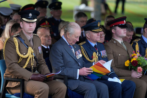 King Charles III, 2nd left, sits during a visit to the National Memorial Arboretum in Alrewas, Staffordshire, for the dedication ceremony of the LGBT+ Armed Forces memorial, the UK's first national memorial commemorating LGBT+ people who have served and continue to serve in the military, Monday Oct. 27, 2025. (Peter Byrne/PA via AP) King Charles III, 2nd left, sits during a visit to the National Memorial Arboretum in Alrewas, Staffordshire, for the dedication ceremony of the LGBT+ Armed Forces memorial, the UK's first national memorial commemorating LGBT+ people who have served and continue to serve in the military, Monday Oct. 27, 2025. (Peter Byrne/PA via AP)