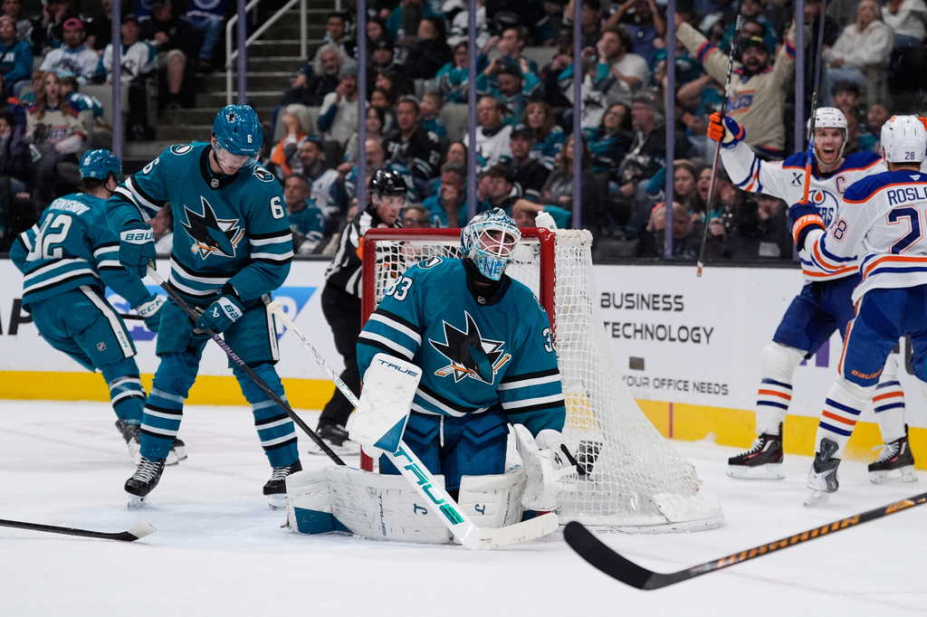 San Jose Sharks goaltender Alex Nedeljkovic (33) reacts after a goal by Edmonton Oilers center Connor McDavid during the second period of an NHL hockey game, Wednesday, April 8, 2026, in San Jose, Calif. (AP Photo/Godofredo A. Vásquez)