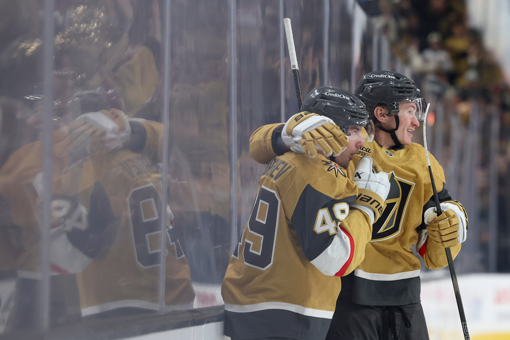 Vegas Golden Knights left wing Ivan Barbashev (49) and defenseman Kaedan Korczak (6) celebrates after Barbashev's goal against the Utah Mammoth during the second period in Game 2 of a first-round NHL hockey Stanley Cup playoff series Tuesday, April 21, 2026, in Las Vegas. (AP Photo/Ian Maule)