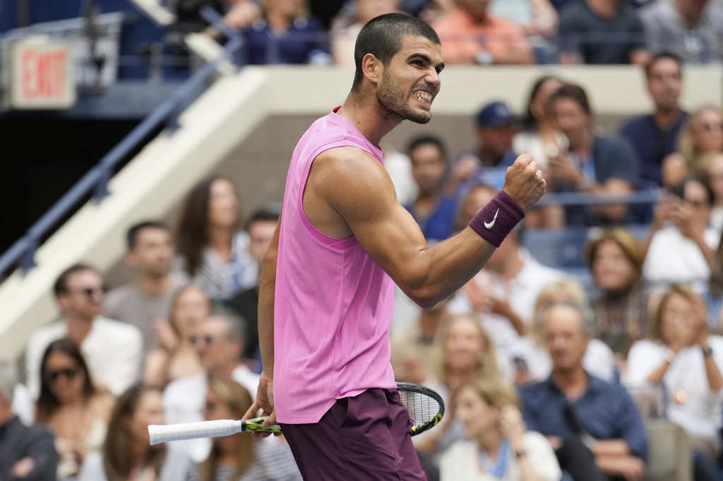 Carlos Alcaraz, of Spain, celebrates after defeating Novak Djokovic, of Serbia, during the men's singles semifinals of the U.S. Open tennis championships, Friday, Sept. 5, 2025, in New York. (AP Photo/Seth Wenig)