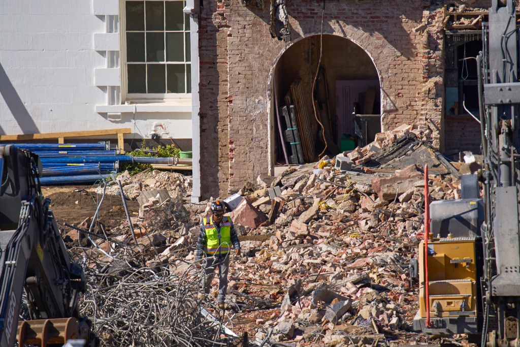 A worker walks through debris at a largely demolished part of the East Wing of the White House, Thursday, Oct. 23, 2025, in Washington, before construction of a new ballroom. (AP Photo/Jacquelyn Martin)
