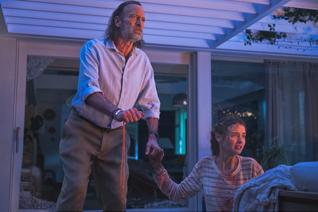 This image released by Paramount Pictures shows Troy Kotsur, left, and Gia Hunter in a scene from "Primate." (Gareth Gatrell/Paramount Pictures via AP)