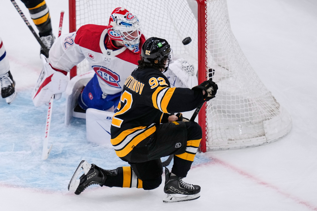 Boston Bruins center Marat Khusnutdinov (92) scores on Montreal Canadiens goaltender Jacob Fowler (32) during the first period of an NHL hockey game, Tuesday, Dec. 23, 2025, in Boston. (AP Photo/Charles Krupa)