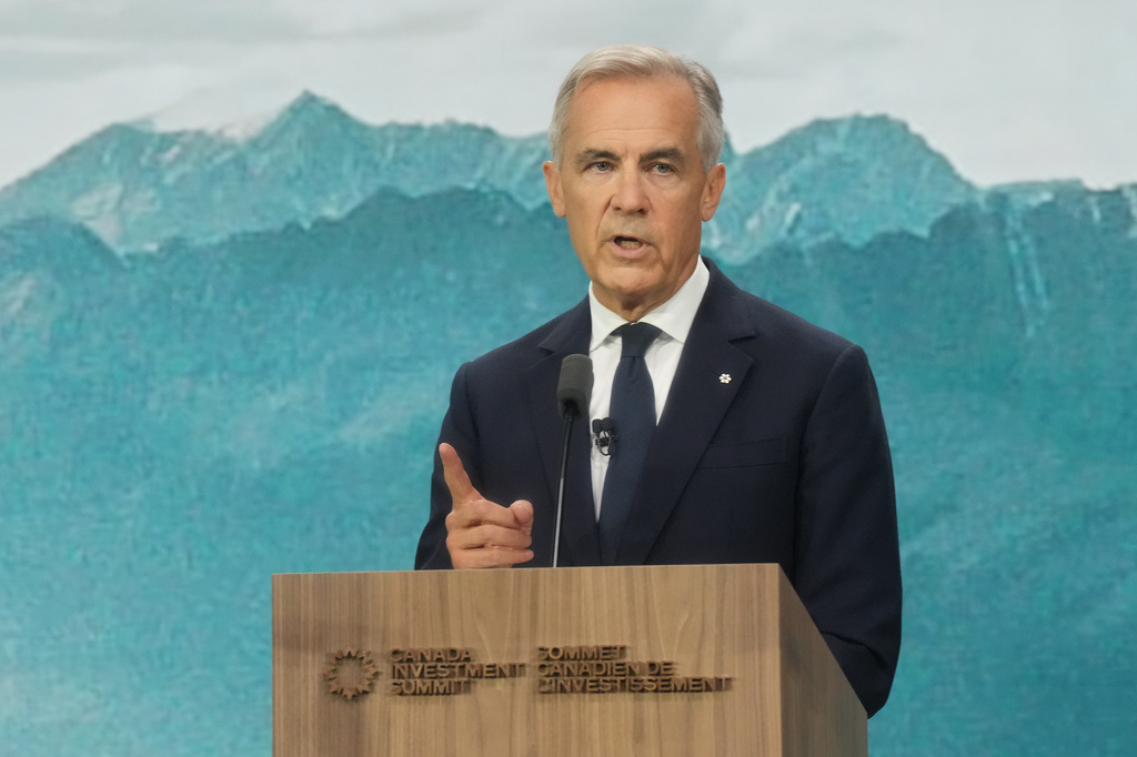 Prime Minister Mark Carney delivers opening remarks during the start of the second day at the 2026 Canada Investment Summit in Toronto, on Tuesday, Sept. 15, 2026. (Nathan Denette/The Canadian Press via AP)