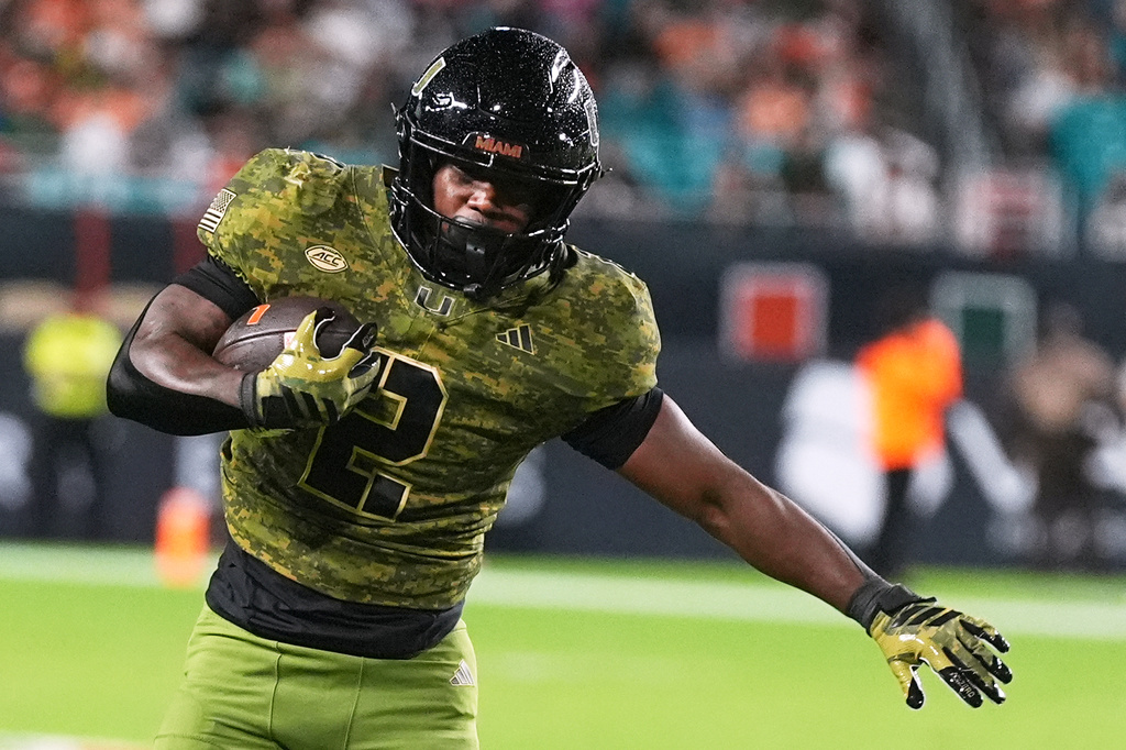 FILE - Miami running back Jordan Lyle runs for a touchdown during the second half of an NCAA college football game against Stanford, Oct. 25, 2025, in Miami Gardens, Fla. (AP Photo/Lynne Sladky, File)