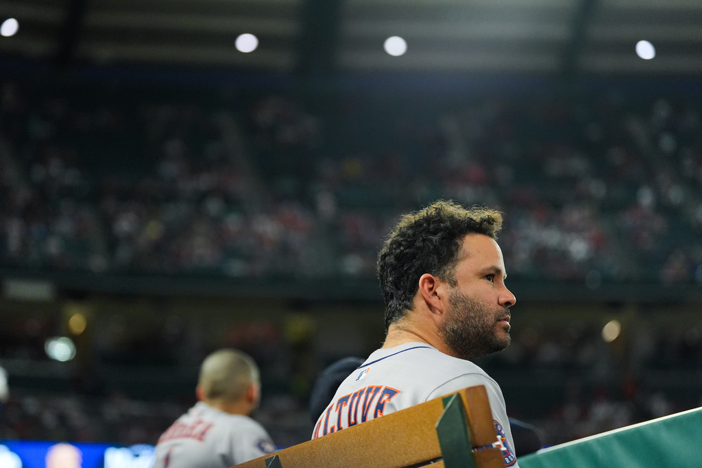 Houston Astros' Jose Altuve watches from the dugout during the second inning of a baseball game against the Los Angeles Angels Saturday, Sept. 27, 2025, in Anaheim, Calif. (AP Photo/Jae C. Hong)