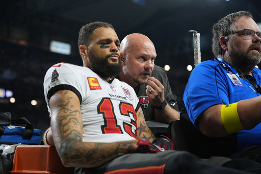 Tampa Bay Buccaneers wide receiver Mike Evans (13) is carted off the field after an injury during the second half of an NFL football game against the Detroit Lions, Monday, Oct. 20, 2025, in Detroit. AP Photo/Ryan Sun) Tampa Bay Buccaneers wide receiver Mike Evans (13) is carted off the field after an injury during the second half of an NFL football game against the Detroit Lions, Monday, Oct. 20, 2025, in Detroit. AP Photo/Ryan Sun)