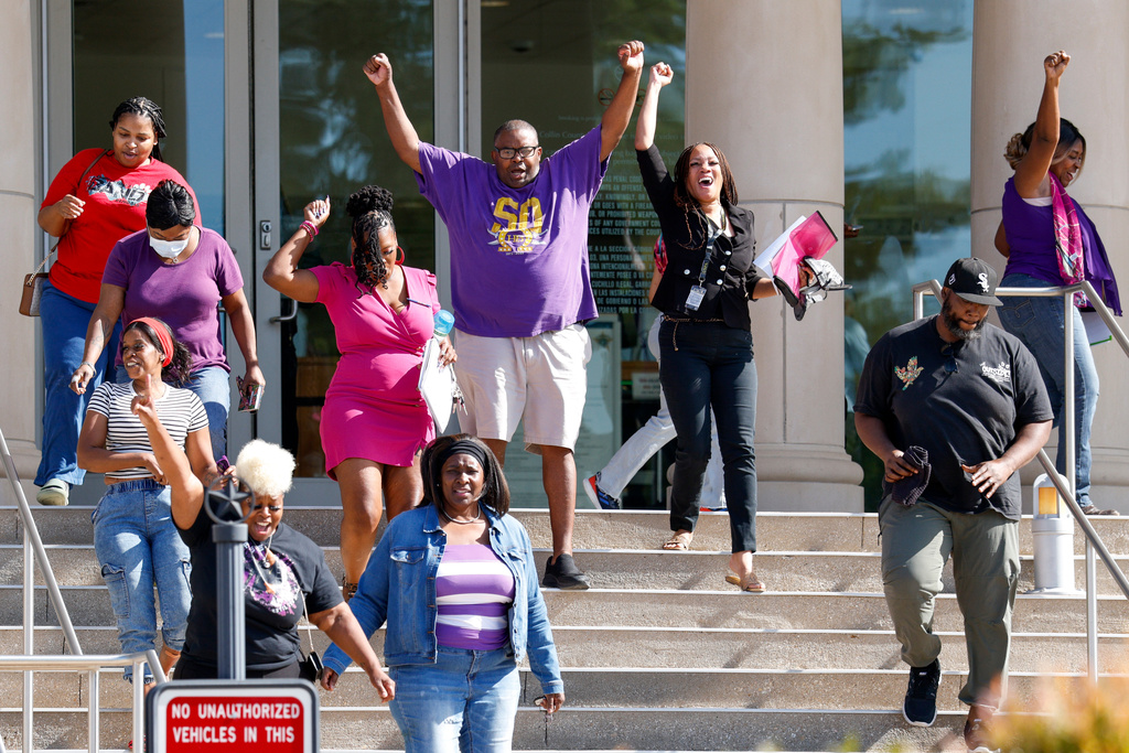 Supporters of Karmelo Anthony react after Judge John Roach Jr. was recused from the next phase of Anthony's murder trial outside the Collin County Courthouse on Wednesday, Aug. 19, 2026, in McKinney, Texas. (Elías Valverde II/The Dallas Morning News via AP)