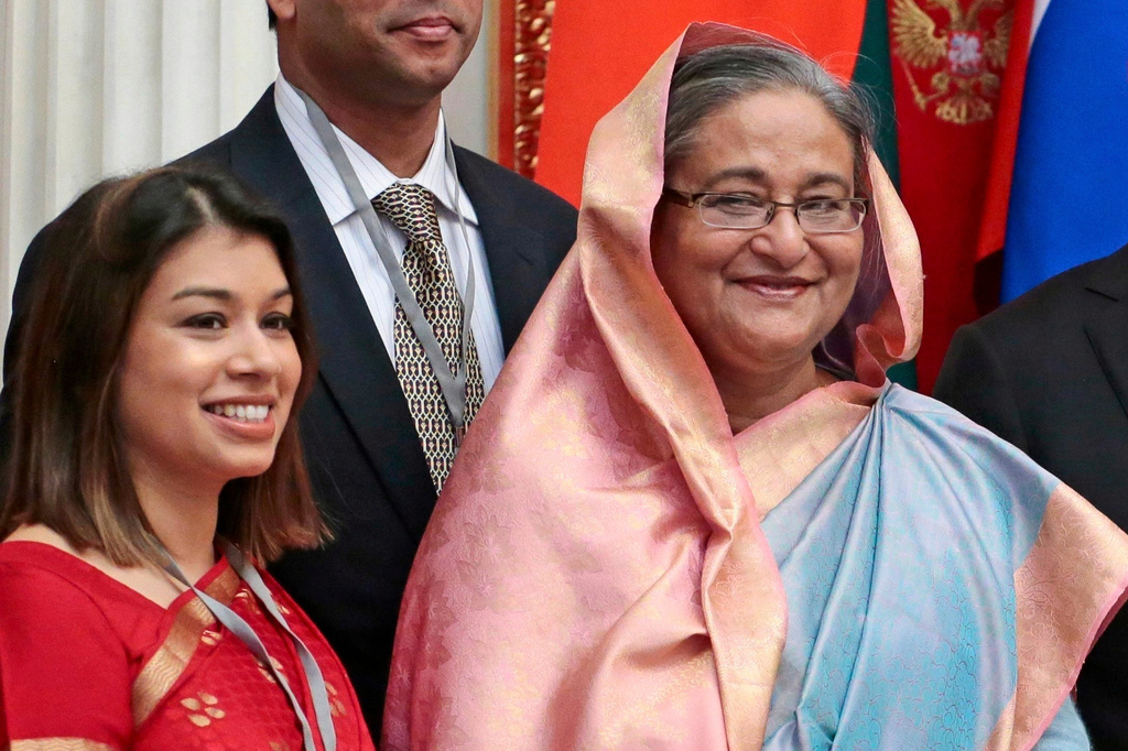 FILE - Tulip Siddiq, left, stands beside Bangladesh Prime Minister Sheikh Hasina in the Kremlin in Moscow, Russia, on Jan. 15, 2013. (AP Photo/Mikhail Metzel, Pool, File)