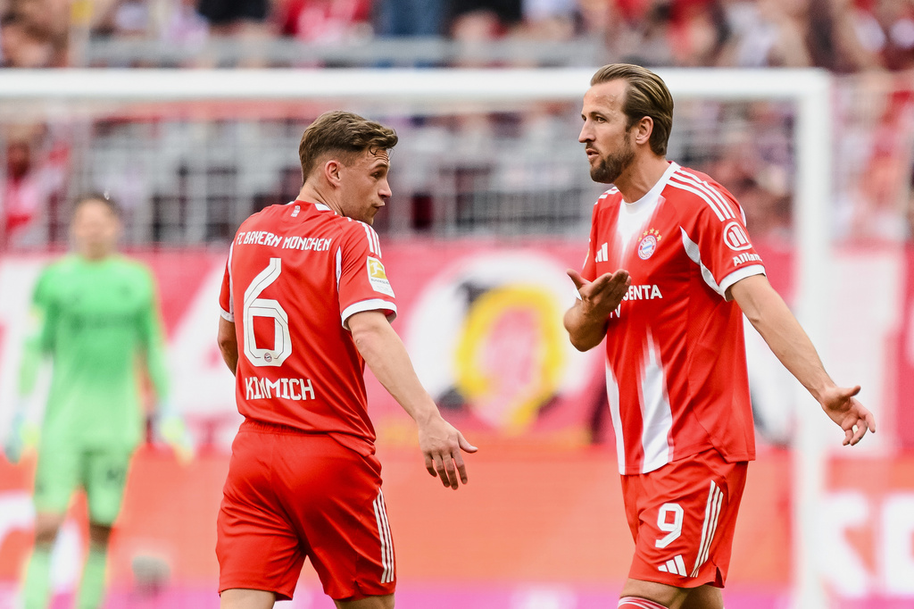 Bayern's Joshua Kimmich, left, and Harry Kane react during a German Bundesliga soccer match between Bayern Munich and 1. FC Heidenheim in Munich, Germany, Saturday, May 2, 2026. (Harry Langer/dpa via AP)
