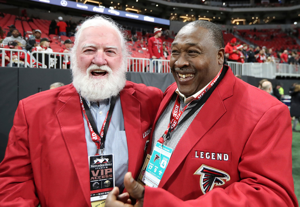 FILE - Former Atlanta Falcons center Jeff Van Note, left, and running back William Andrews smile on the sideline before the team's NFL football game against the New Orleans Saints on Dec. 7, 2017, in Atlanta. (Curtis Compton/Atlanta Journal-Constitution via AP, File)