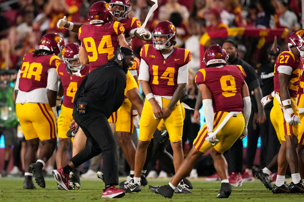 Southern California safety Kennedy Urlacher (9) celebrates with quarterback Jayden Maiava (14) after he caused a fumble by Fresno State quarterback Jayden Mandal that was recovered by USC during the first half of an NCAA college football game, Friday, Sept. 4, 2026, in Los Angeles. (AP Photo/Mark J. Terrill)