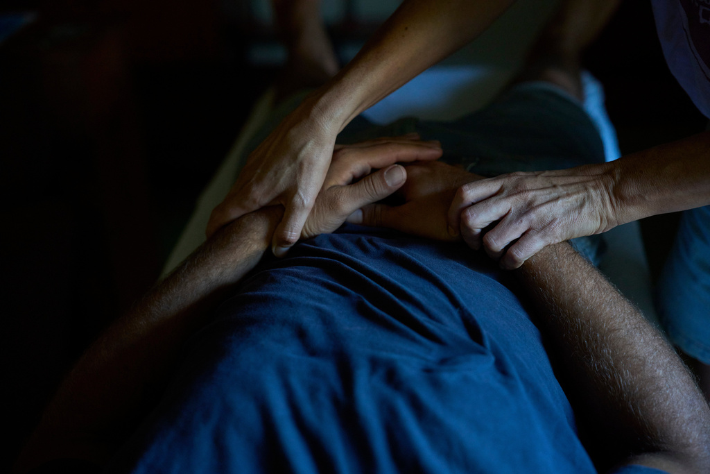 An Israeli soldier receives touch therapy at a farm in central Israel run by Back2Life, a group helping soldiers combat mental health problems, in Kibbutz Sdot Yam, Israel, on Oct. 16, 2025. (AP Photo/Ohad Zwigenberg)