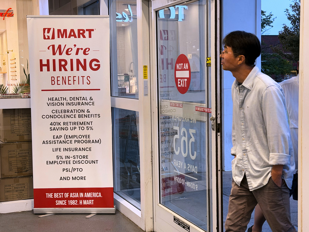 A hiring sign is displayed at a grocery store, in Schaumburg, Ill., Wednesday, Sept. 16, 2026. (AP Photo/Nam Y. Huh)