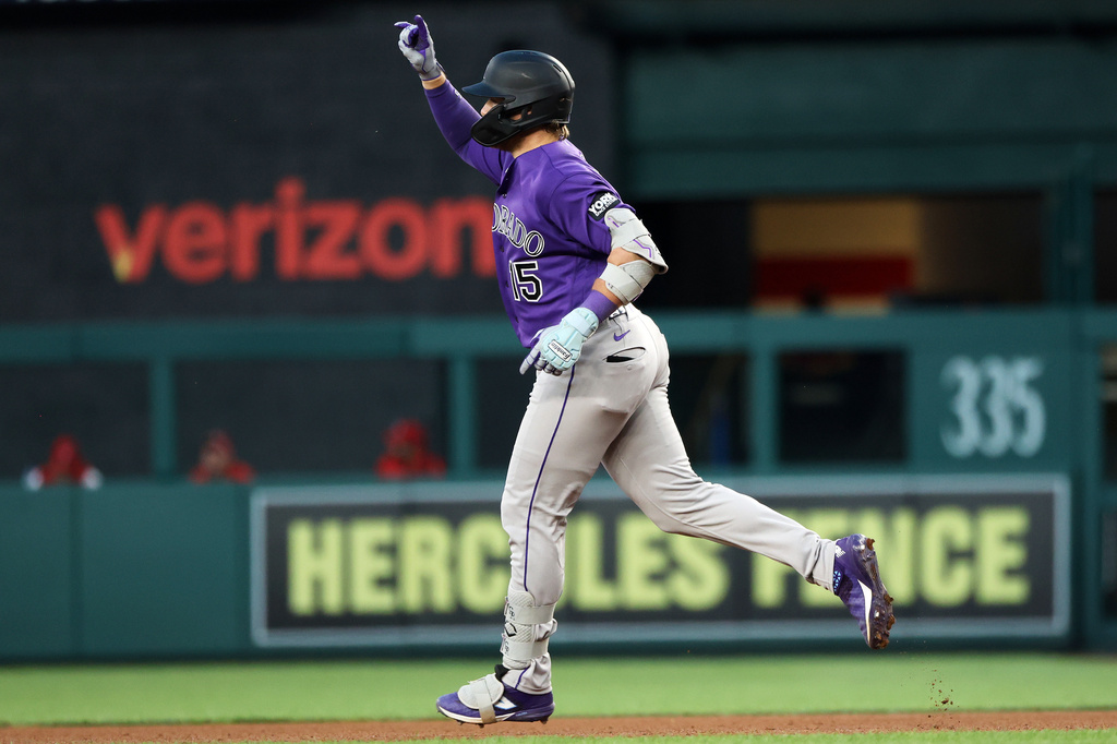 Colorado Rockies' Hunter Goodman celebrates after hitting a home run during the fourth inning of a baseball game against the Washington Nationals, Tuesday, Aug. 25, 2026, in Washington. (AP Photo/Daniel Kucin Jr.)