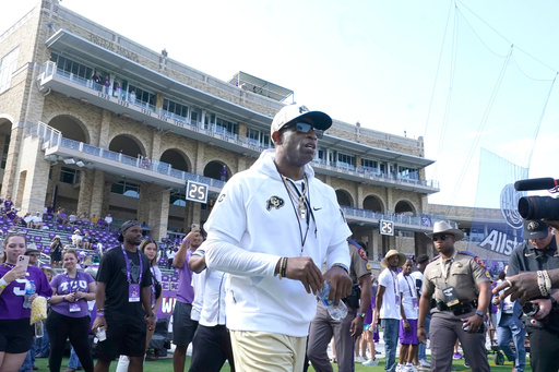 FILE - Colorado head coach Deion Sanders walks the field before an NCAA college football game against TCU Saturday, Sept. 2, 2023, in Fort Worth, Texas. (AP Photo/LM Otero,File) FILE - Colorado head coach Deion Sanders walks the field before an NCAA college football game against TCU Saturday, Sept. 2, 2023, in Fort Worth, Texas. (AP Photo/LM Otero,File)
