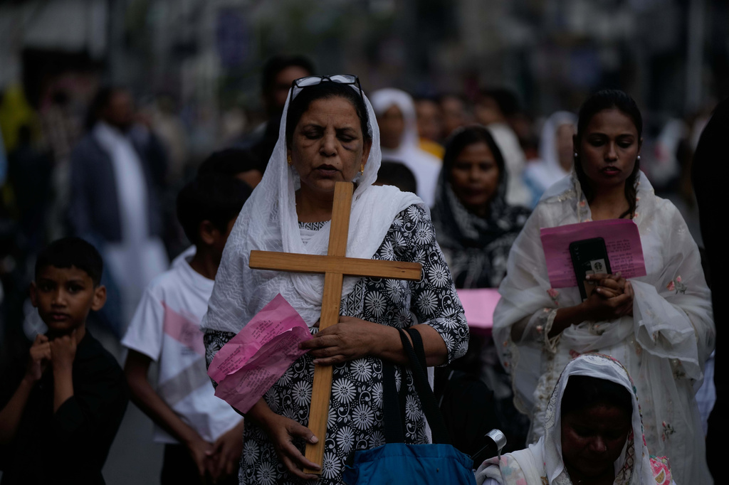 Indian Christian devotees pray during a procession to mark Good Friday in Jammu, India, Friday, April 3, 2026.(AP Photo/Channi Anand)