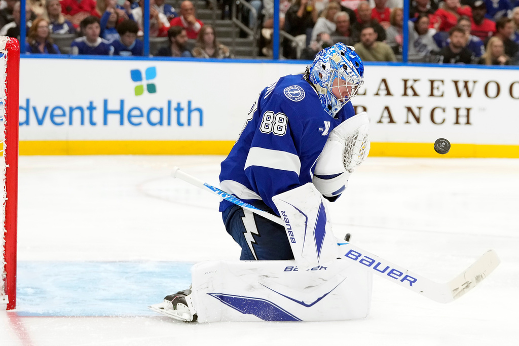 Tampa Bay Lightning goaltender Andrei Vasilevskiy (88) makes a save on a shot by the Detroit Red Wings during the third period of an NHL hockey game Thursday, March 12, 2026, at Benchmark International Arena in Tampa, Fla. (AP Photo/Chris O'Meara)