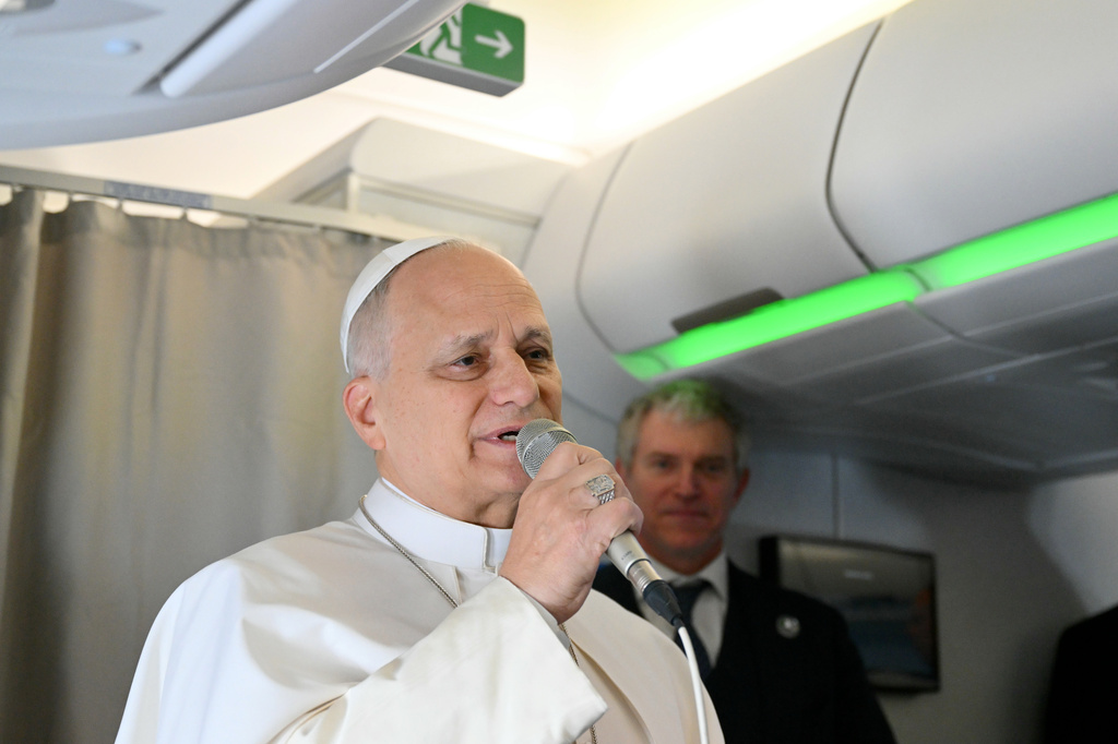 Pope Leo XIV speaks to journalists aboard his flight bound for Algiers’ Houari Boumédiène International Airport on Monday, April 13, 2026, at the start of an 11-day apostolic journey to Africa. (Alberto Pizzoli/Pool Photo via AP)