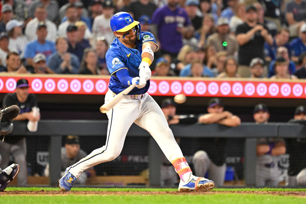 Minnesota Twins' Royce Lewis hits a walkoff single, scoring Kyler Fedko, against Colorado Rockies during the 10th inning of a baseball game Friday, June 26 2026, in Minneapolis. (AP Photo/Craig Lassig)