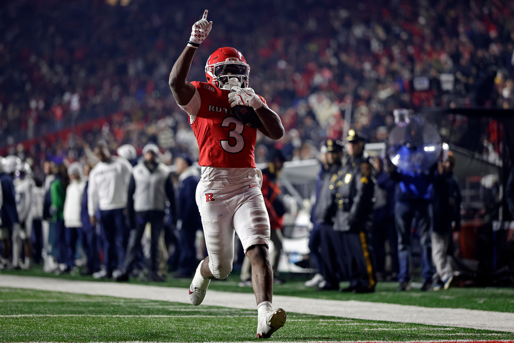 Rutgers running back Antwan Raymond reacts to scoring a touchdown during the second half of an NCAA college football game against Penn State, Saturday, Nov. 29, 2025, in Piscataway, N.J. (AP Photo/Adam Hunger)