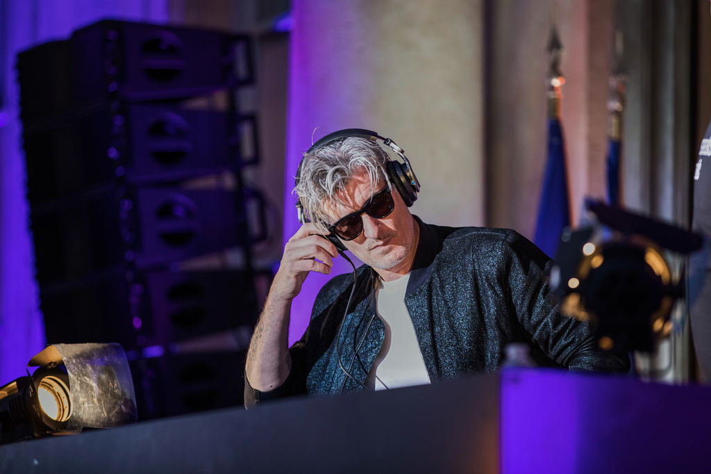 FILE - French Vincent Belorgey, known as Kavinsky, performs during the 'Fete de la Musique', the music day celebration in the courtyard of the Elysee Palace, in Paris, Thursday, 21 June 2018. (Christophe Petit Tesson, Pool via AP, FILE)