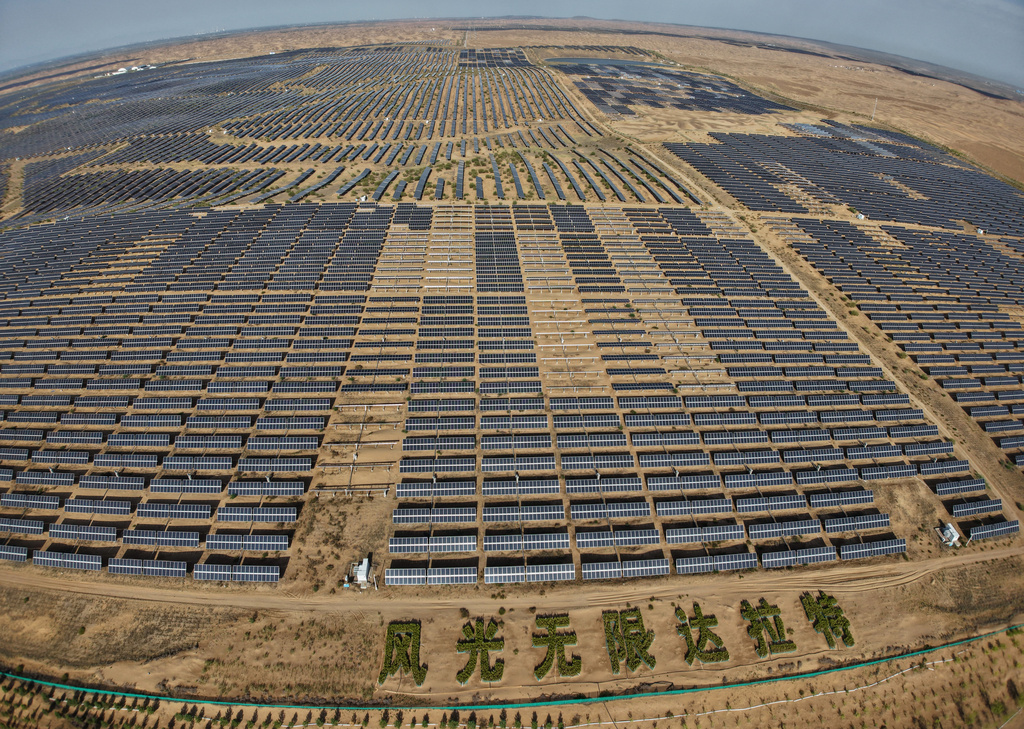 Solar panels operate at the Dalad Banner Photovoltaic Top Runner Base in northern China's Inner Mongolia province on Friday, June 12, 2026. (AP Photo/Ng Han Guan)