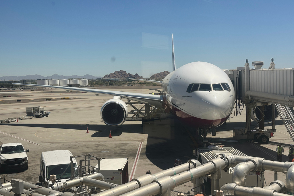 The Arizona Cardinals' team plane waits at a gate at Phoenix Sky Harbor International Airport in Phoenix to take teams from Arizona and New Mexico to Minneapolis for the 2026 Special Olympics USA Games Friday, June 19, 2026. (AP Photos/John Marshall)