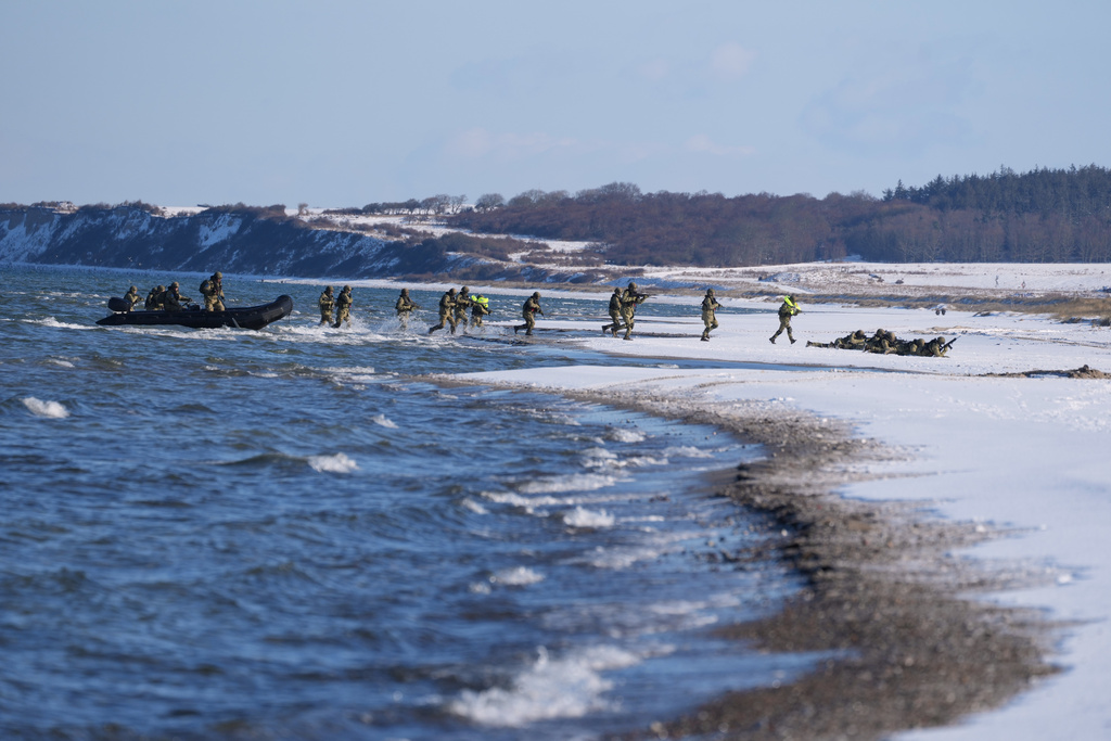 Soldiers arrive on the beach during an amphibious landing operation conducted by the Allied Reaction Force during NATO led military exercises on Wessek Beach in Putlos, Germany, Wednesday, Feb. 18, 2026. (AP Photo/Virginia Mayo)
