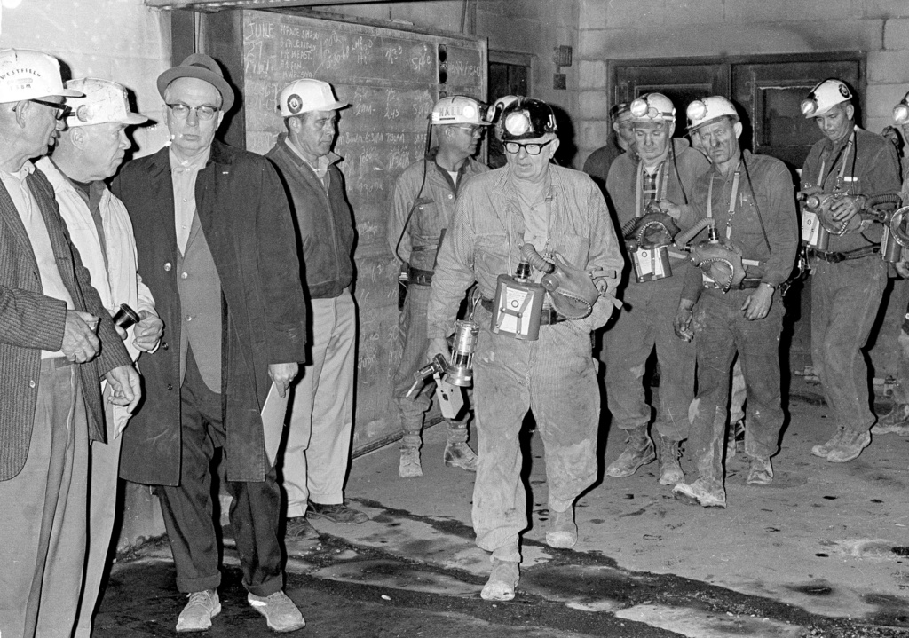 FILE - The second of two seven-man search teams exit a mine shaft, near Farmington, W.Va. The No. 9 mine explosion killed 78 miners, Nov. 24, 1968. (AP Photo/File)