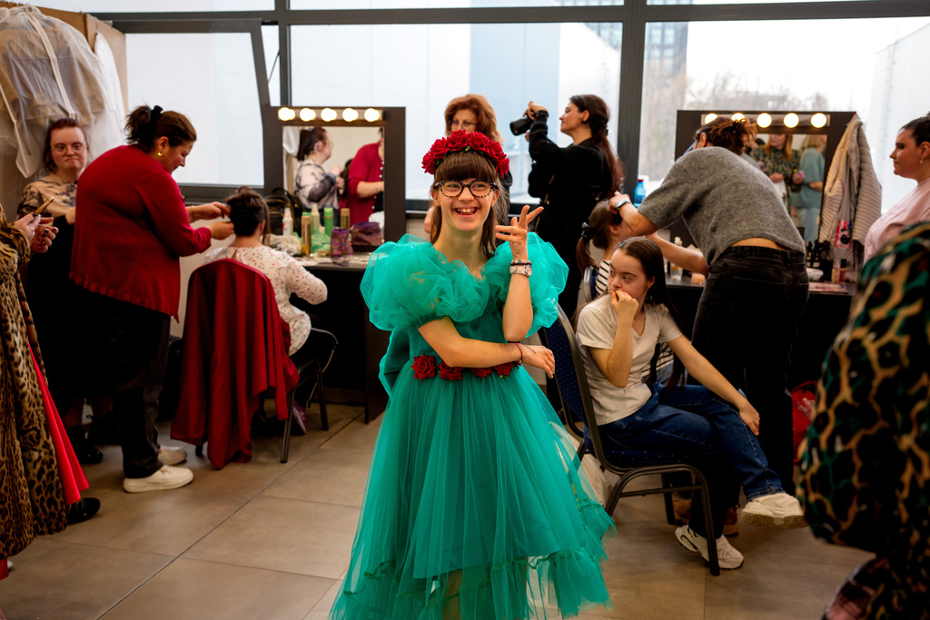 Antonia Voicu laughs before the SEEN Anonymous Seamstresses Gala, an event organised by the Down Plus Bucharest, an NGO supporting youngsters with Down Syndrome and other intellectual disabilities, in Bucharest, Romania, Wednesday, March 18, 2026, ahead of the World Down Syndrome Day, on March 21. (AP Photo/ Vadim Ghirda)