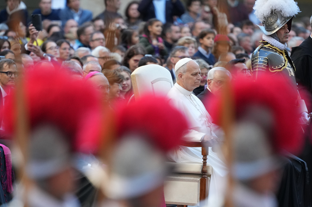 Pope Leo XIV attends the swering in ceremony of 27 Pontifical Swiss Guards cadets in the St. Damasus courtyard at the Vatican, Saturday, Oct. 4, 2025. (AP Photo/Andrew Medichini)