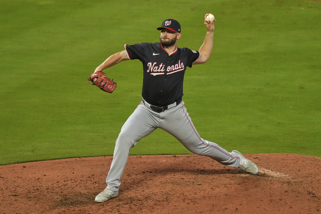 Washington Nationals starting pitcher Konnor Pilkington throws during the sixth inning of a baseball game against the Kansas City Royals, Tuesday, Aug. 12, 2025, in Kansas City, Mo. (AP Photo/Charlie Riedel)