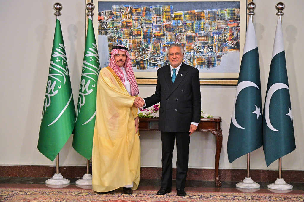 In this photo, released by the Pakistan Ministry of Foreign Affairs, Saudi Arabia's Foreign Minister Prince Faisal bin Farhan Al-Saud, left, shakes hand with his Pakistani counterpart Ishaq Dar, prior to their meeting in Islamabad, Pakistan, Sunday, March 29, 2026. (Pakistan Ministry of Foreign Affairs via AP)