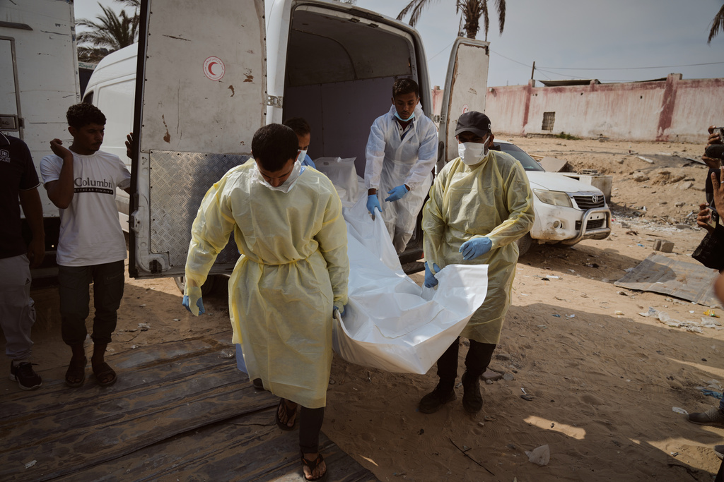 Bodies of unidentified Palestinians returned from Israel as part of the ceasefire deal are brought to Nasser Hospital in Khan Younis, Gaza Strip, Monday, Nov. 3, 2025. (AP Photo/Jehad Alshrafi)