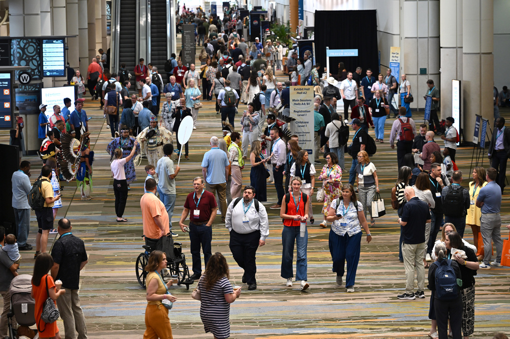 Attendees walk through the Orange County Convention Center during the annual meeting of the Southern Baptist Convention, Tuesday, June 9, 2026, in Orlando, Fla. (AP Photo/Phelan M. Ebenhack)