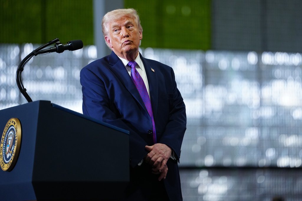 President Donald Trump pauses after a person in the crowd needed medical assistance as he speaks at Verst Logistics Wednesday, March 11, 2026, in Hebron, Ky. (AP Photo/Julia Demaree Nikhinson)