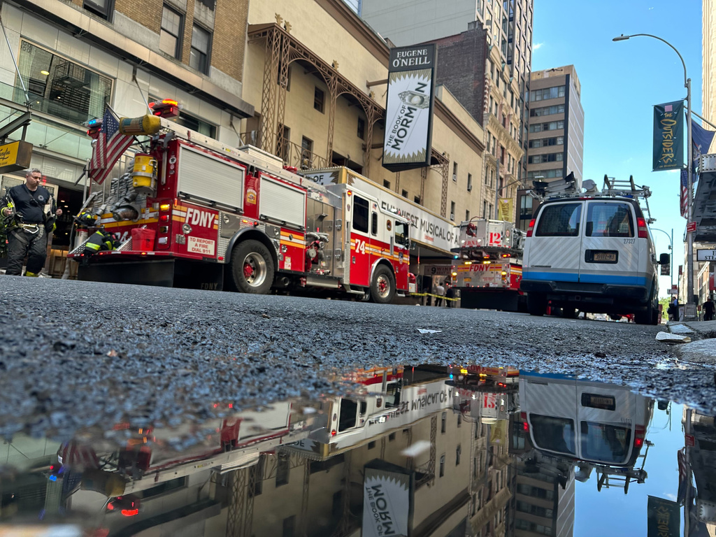 Firetrucks are parked outside of the Eugene O'Neill Theatre in New York on Monday, May 4, 2026. (AP Photo/David Martin)