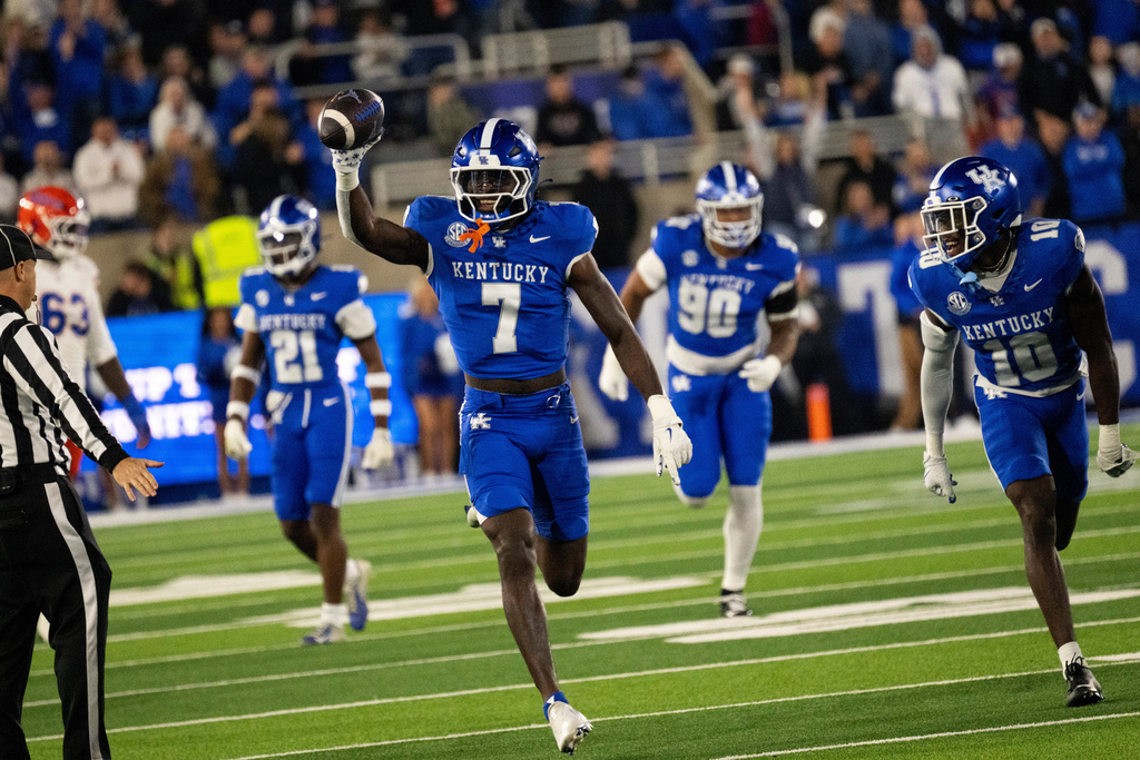Kentucky linebacker Daveren Rayner (7) celebrates after intercepting the ball in the second quarter of an NCAA college football game against Florida, Saturday, Nov. 8, 2025, in Lexington, Ky. (AP Photo/Michael Swensen)