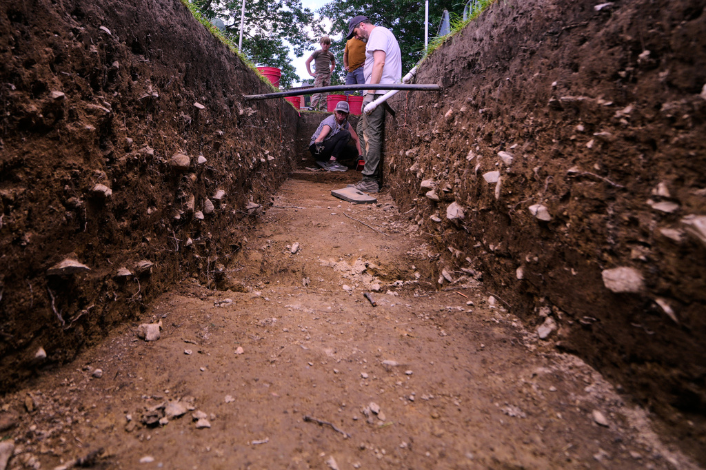 Joe Bagley, right, the City of Boston Archeologist, talks with with Sarah Kiley Schoff, a forensic anthropologist, during an archaeological dig at the site of the Battle of Bunker Hill, Monday, June 15, 2026, in Boston. (AP Photo/Charles Krupa)