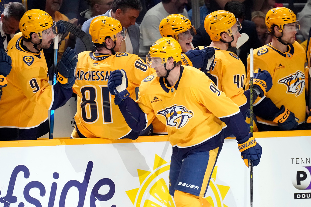 Nashville Predators center Steven Stamkos (91) is congratulated after scoring against the Minnesota Wild during the first period of an NHL hockey game Saturday, April 11, 2026, in Nashville, Tenn. (AP Photo/Mark Humphrey)