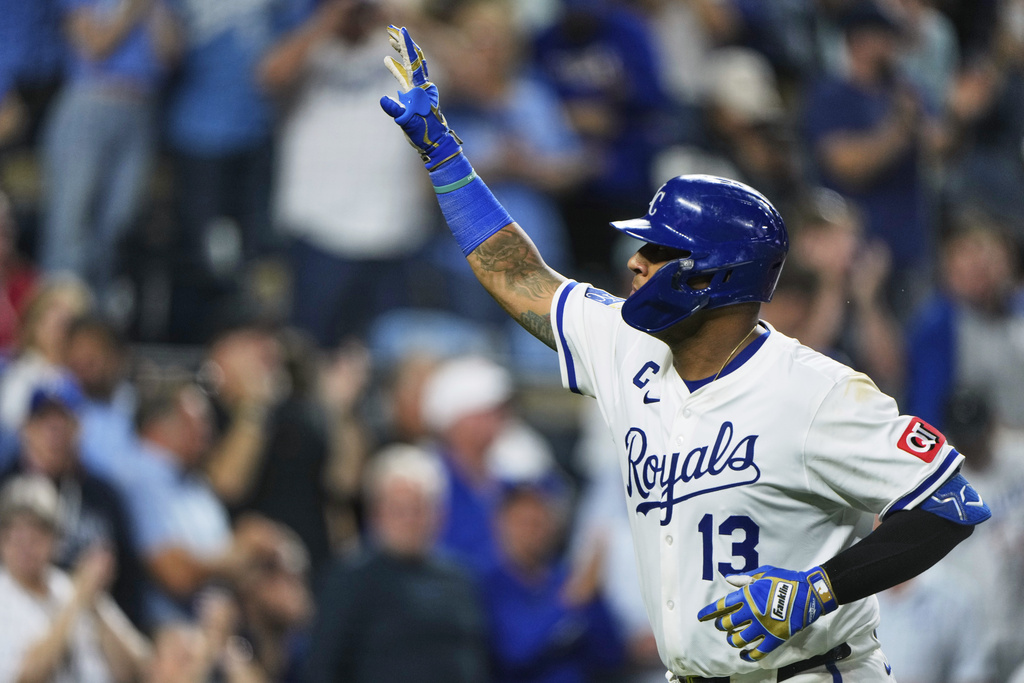 Kansas City Royals' Salvador Perez celebrates as he crosses the plate after hitting a solo home run during the seventh inning of a baseball game against the Los Angeles Angels, Thursday, Sept. 4, 2025, in Kansas City, Mo. (AP Photo/Charlie Riedel)
