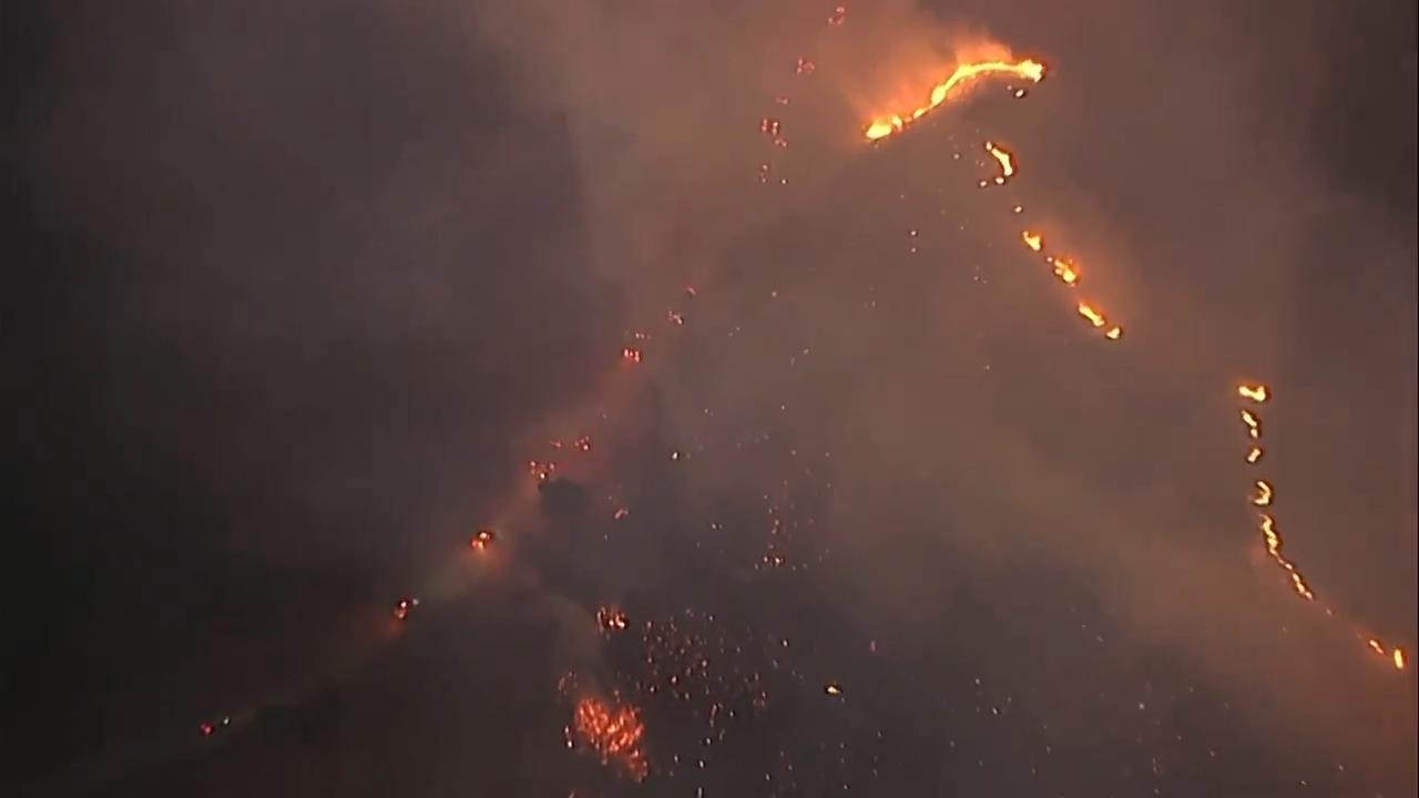 Several brush fires were burning in Southern California on Thursday evening, stoked by hot, windy weather that caused utility companies to shut off electricity for tens of thousands of people around the state. A rapidly spreading blaze in Malibu, a coastal town west of Los Angeles, prompted evacuation orders and warnings for a large swathe of the Santa Monica Mountains.