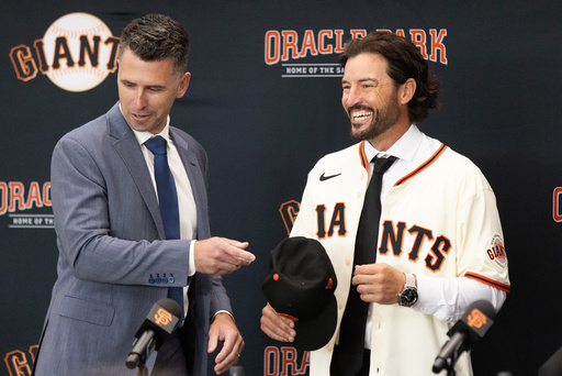 San Francisco Giants President of Baseball Operations Buster Posey, left, welcomes Tony Vitello as the new manager of the San Francisco Giants baseball team on Thursday, Oct. 30, 2025, in San Francisco. (AP Photo/Benjamin Fanjoy) San Francisco Giants President of Baseball Operations Buster Posey, left, welcomes Tony Vitello as the new manager of the San Francisco Giants baseball team on Thursday, Oct. 30, 2025, in San Francisco. (AP Photo/Benjamin Fanjoy)