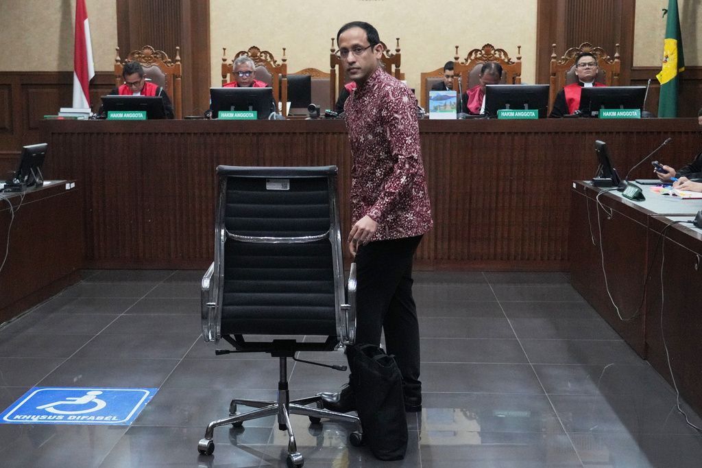 Nadiem Anwar Makarim, the co-founder of Indonesia's payments platform and ride hailing company Gojek and former education minister, enters the courtroom for his trial hearing at the Corruption Court in Jakarta, Indonesia, Wednesday, May 13, 2026. (AP Photo/Tatan Syuflana)