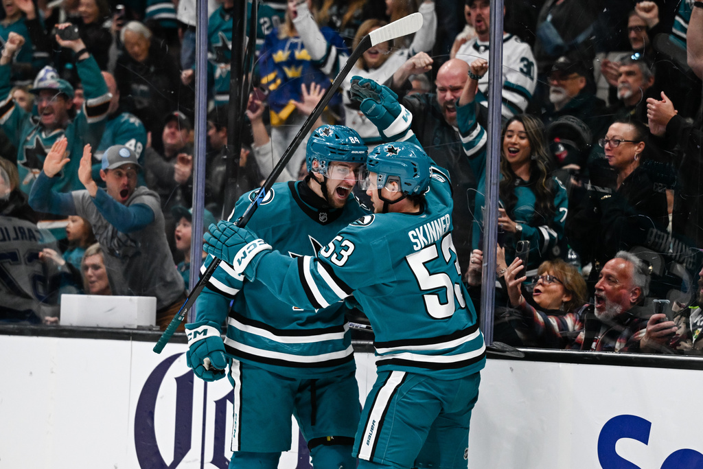 San Jose Sharks left wing Pavol Regenda (84), left, celebrates with left wing Jeff Skinner (53) after scoring a goal against the Tampa Bay Lightning during the first period of an NHL hockey game Saturday, Jan. 3, 2026, in San Jose, Calif. (AP Photo/Thien-An Truong)
