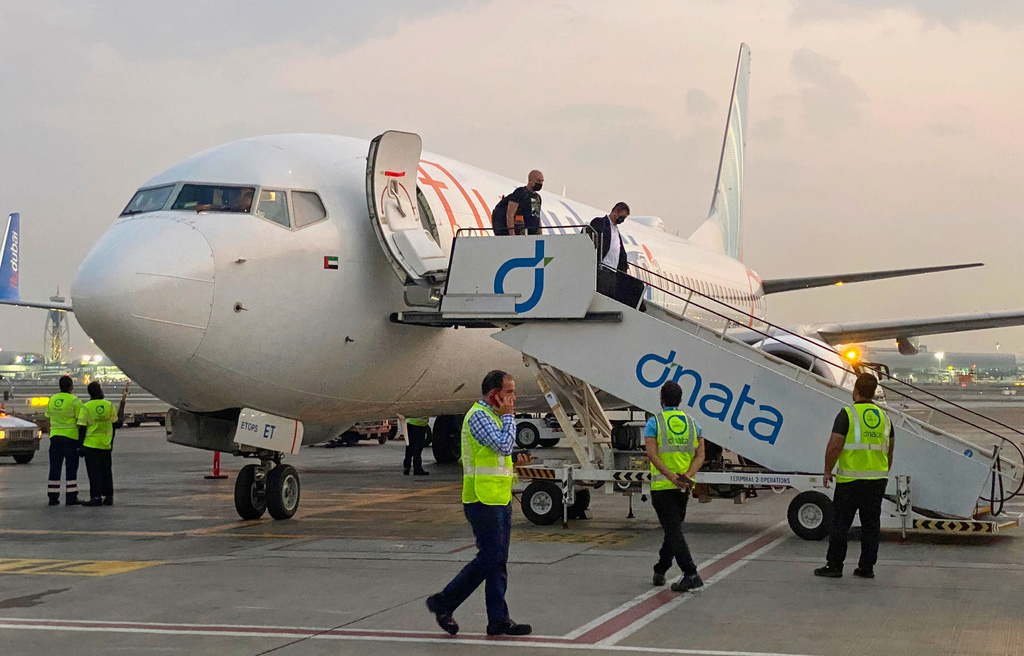FILE - Israeli tourists leave a FlyDubai plane which departed from Ben-Gurion International Airport in Tel Aviv and landed in Dubai, United Arab Emirates, Nov. 8, 2020.(AP Photo/Malak Harb, File)