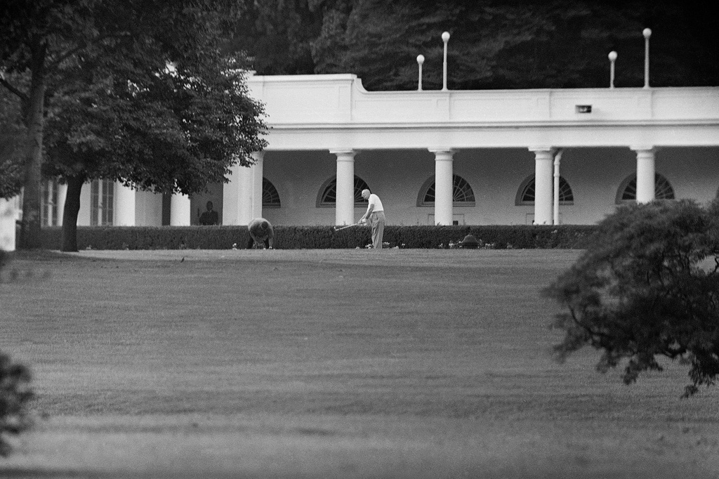 FILE - President Dwight D. Eisenhower, getting in a final bit of relaxation on the eve of the visit by Soviet Premier Nikita Khrushchev, practices a few iron shots the South Lawn of the White House in Washington, Sept. 14, 1959. (AP Photo, File)