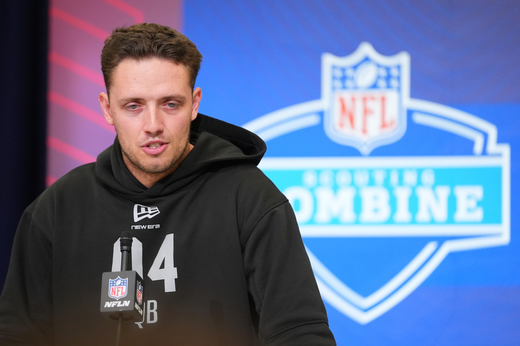 FILE - Miami quarterback Carson Beck speaks during a news conference at the NFL football scouting combine in Indianapolis, Friday, Feb. 27, 2026. (AP Photo/Julio Cortez, File)